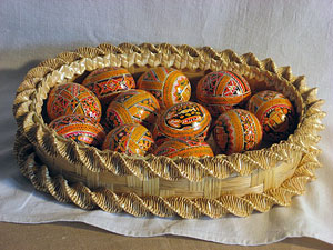 Wooden basket with painting eggs